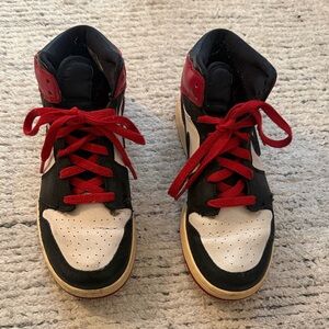 Nike mid Jordan 1’s red black and white